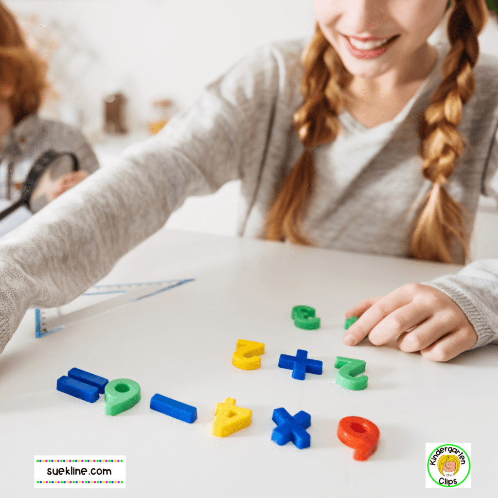 A girl is using magnetic numbers to show math facts on a chite board.