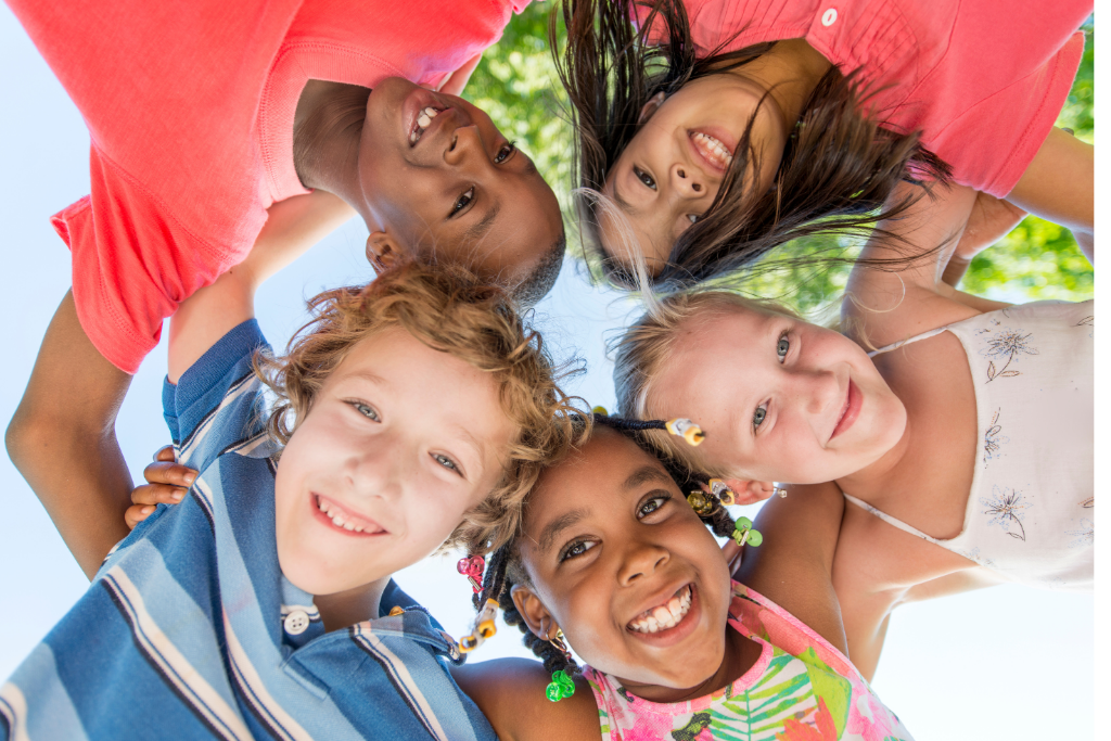 kids in a group smiling